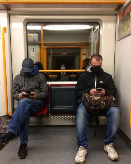 In the middle . . . . . . . #train #trainride #mask #photography #streetphotography #middle #reflect