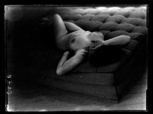 fragrantblossoms: Martin Munkacsi [Baroness von Landenberg lying on cushion]