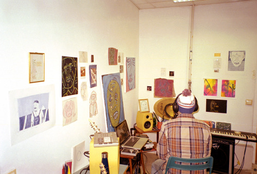 Bryn Bowen recording in his studio surrouned by his own artworks