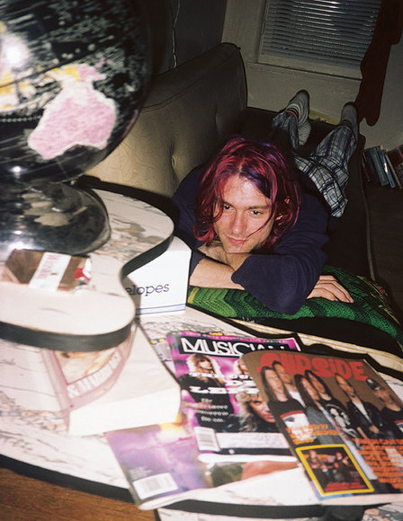 nirvana-drain-you:Kurt Cobain in the living room of his Los Angeles apartment on Spaulding Avenue, s