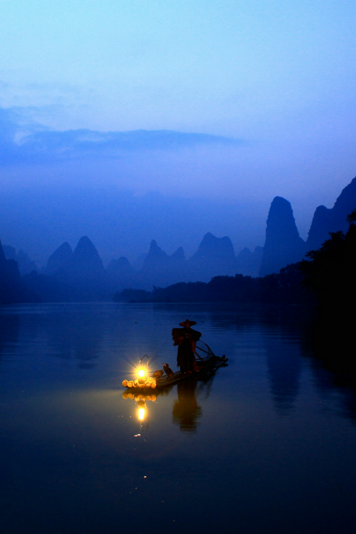 tulipnight:  A fisherman on Li river, Guangxi, China by May    xiaomeisun (☺) on