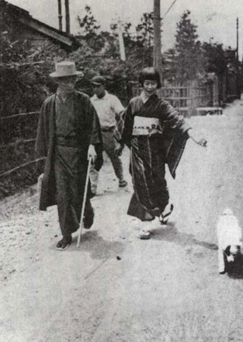 Japanese writer Yasunari Kawabata walking with his wife Hideko and his dog, Asakusa, Tokyo - 1928-29