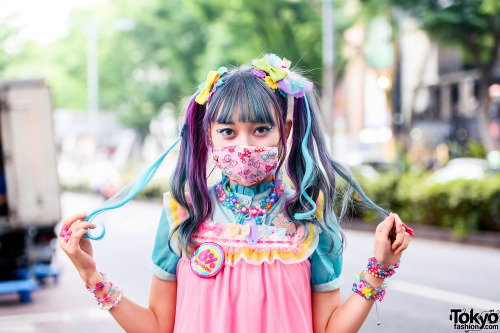 Kawaii Japanese street style personality Emiry on the street in Harajuku with colorful twin tails, a