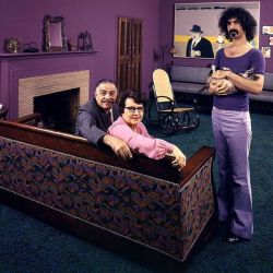 life:  From the Sep. 24, 1971 cover story: ROCK STARS AT HOME WITH THEIR PARENTS. Frank Zappa in his Los Angeles home with his dad, Francis, his mom, Rosemarie, and his cat in 1970. (John Olson—The LIFE Picture Collection/Getty Images) #LIFElegends