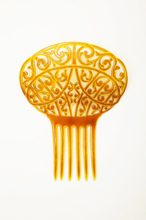 Combs, 1840-1909. Made of celluloid, one of tortoise shell. Via Goldstein Museum of Design.