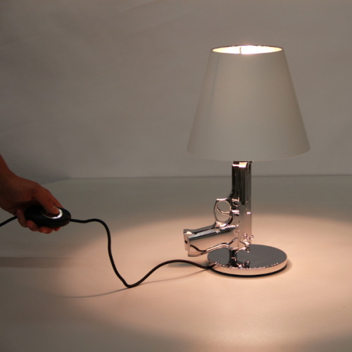 dspallas: dspallas: Gun table lamp by Philippe Starck for Flos. “Design is my weapon”