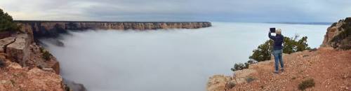 The rim above the clouds These photos capture clouds filling almost the entire Grand Canyon due to a