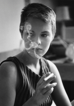 wehadfacesthen:  Jean Seberg during the filming of Jean-Luc Godard’s A Bout de Souffle, Paris, 1959, photo by   Raymond Cauchetier    Patricia Franchini (Seberg’s character in the film): It’s sad to fall asleep. It separates people. Even when