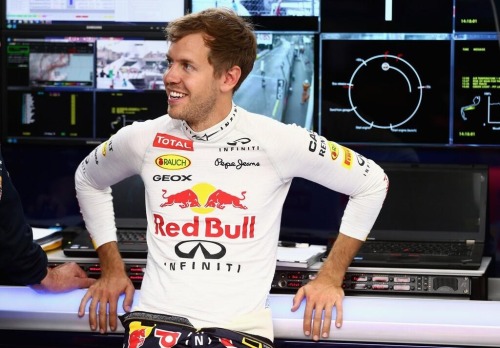 sligodreamer:Sebastian Vettel smiling in the garage during FP.Source: @sebvettelnews