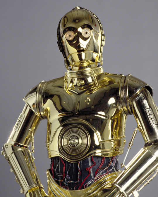 casfree:  So in episode one, R2 tells C3PO that he’s naked because his parts are showing. And when 3PO is complete, he has wires and things showing at his midriff. Conclusion: C3PO wears a crop top. 