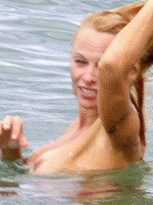 toplessbeachcelebs:  Pamela Anderson (Actress) swimming topless in France (June 2013)