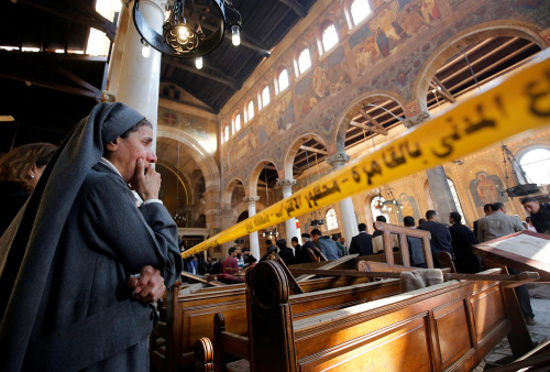 yahoonewsphotos:Bomb blast kills dozens at Cairo Coptic churchA bombing at a chapel adjacent to Egyp