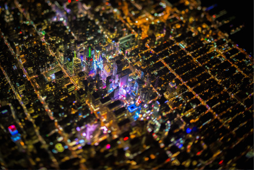 flavorwire:  Breathtaking Neon-Tinged Aerial Shots of New York City at Night