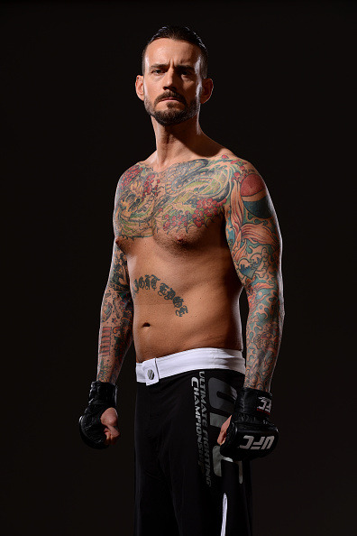 thepunknation:UFC Photoshoot Part Two‘DALLAS, TX - MARCH 13:  Phil ‘CM Punk’ Brooks poses for a photo during a UFC photo session at the Hilton Anatole Hotel on March 13, 2015 in Dallas, Texas. (Photo by Mike Roach/Zuffa LLC/Zuffa LLC via Getty