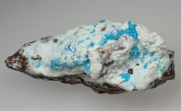 bijoux-et-mineraux:  Alumino Adamite on white Gibbsite -  Serpieri Mine, Lavrion,