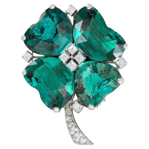 left: Emerald, ruby, and gold clover brooch, Hemmerle, c. 1980s (at 1stdibs)right: Blue-green tourma