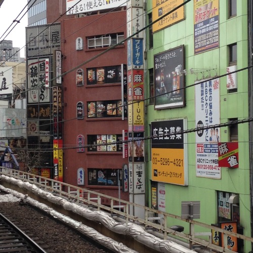 View from the circular “yamanote” line in central Tokyo. Advertising pollution is e