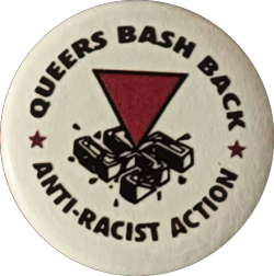 a white pin with a pink triangle piercing a swastica, and black text reading 'QUEERS BASH BACK ANTI-RACIST ACTION'