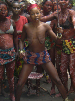 Ekonda woman performing the ritual to mark