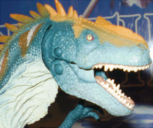 I thought I’d do something a little differently and discuss a new Jurassic Park action figure– The newer Allosaurus from the “Dino Showdown” line, available at Toys R’ Us:   Here I’ve used my figure, and the figure