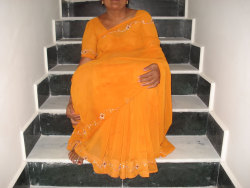iloveindianwomen:  Desi Maid in Yellow Saree Loves to Show Her Cunt. For Full sets go here and here   The last pic is another up-saree pic