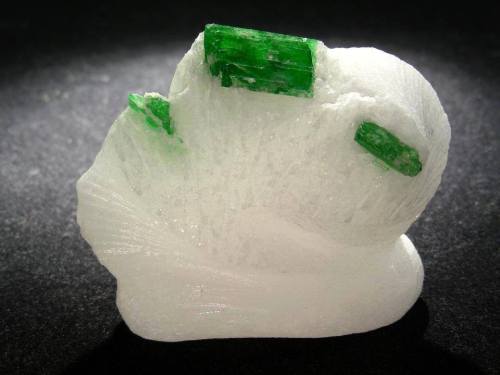 PargasiteThe beautiful green crystal sitting pretty on its matrix of marble was born in the intense 