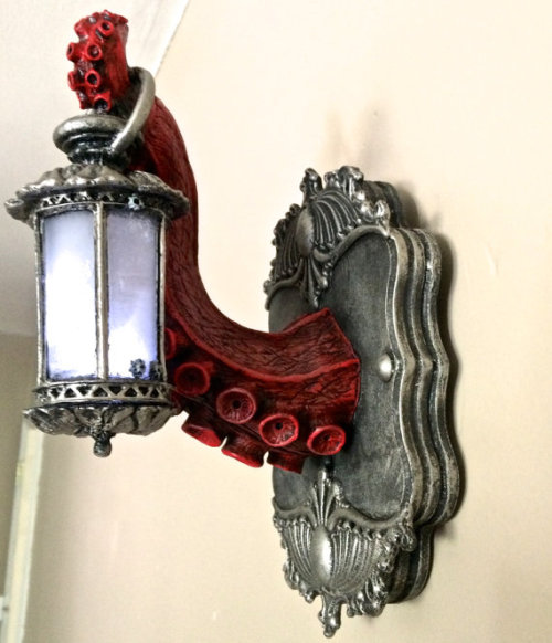apolonisaphrodisia:   Sculpted tentacle holding an ornate Victorian lantern mounted on a resin plaque by   Dellamorte & Co.   Tentacles Group  