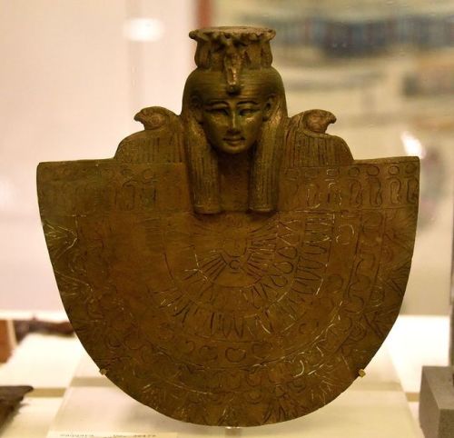 Bronze aegis of the goddess Isis, showing the goddess wearing a tripartite wig with twelve uraeus-se
