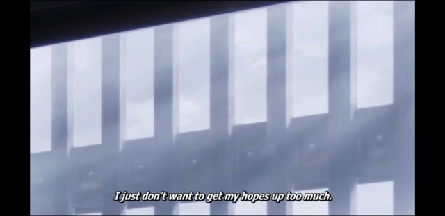 A picture of bars shown through a window. Subtitle: "I just don't want to get my hopes up too much."