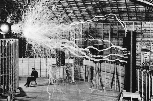 blondebrainpower:Nikola Tesla Sitting In His Laboratory With His “Magnifying Transmitter”  December, 1899