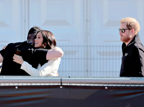 The Duke and Duchess of Sussex greet paralympian Dave Henson at the Invictus Games athletics events 