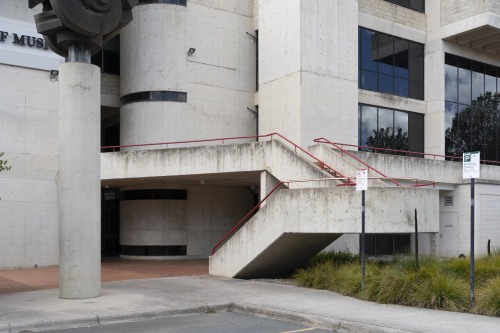 New photos of this beauty… Here, exposed concrete, brick and red-painted steel details come t