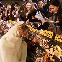 leonardodicrapio:  Margot Robbie drawing a moustache on Leonardo DiCaprio on a poster
