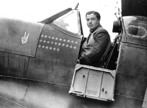 warhistoryonline:Eric Lock in the cockpit of his Spitfire. Just below the cockpit are 26 Swastika em