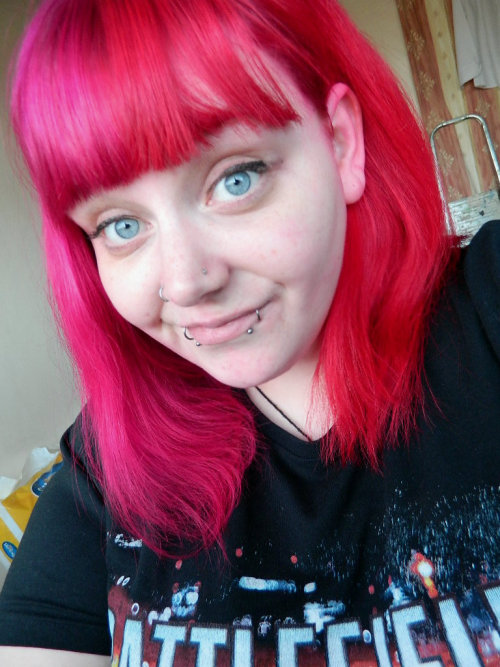 joodleeatsrainbows:  I changed my hair to a darker pink and red, it’s subtle but I like it. And yes I know my ear is dyed red, sue me. 