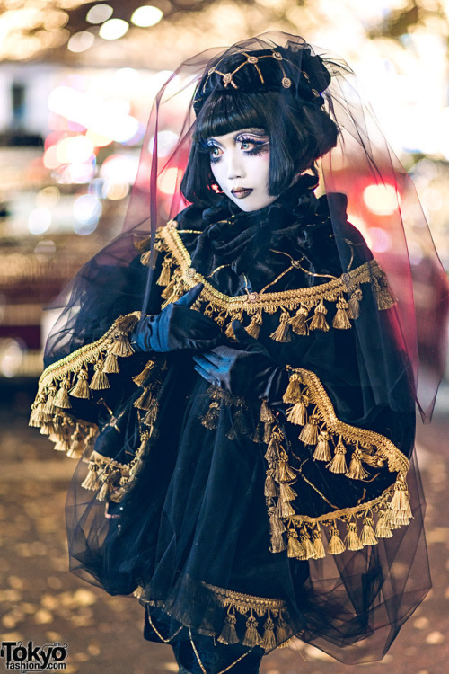 Japanese shironuri artist Minori on the street in Harajuku wearing hand painted shironuri makeup, ha