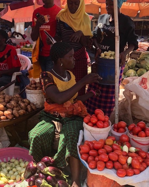 forafricans:A woman sells vegetable produce at her stall. Moshi, Tanzania. ©Mekdela Maskal