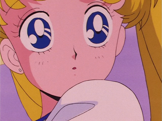 Usagi sits up and turns around to face the creature behind her, eyes wide.