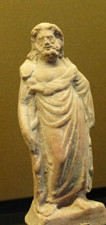 Terracotta figurine of the healing deity Asclepius, with his caduceus.  Artist unknown; 1st cent. BC