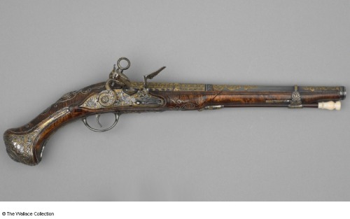 Flintlock pistol crafted by Francisco Lopez of Spain, circa 1800.  Decorated with carvings, gold, si