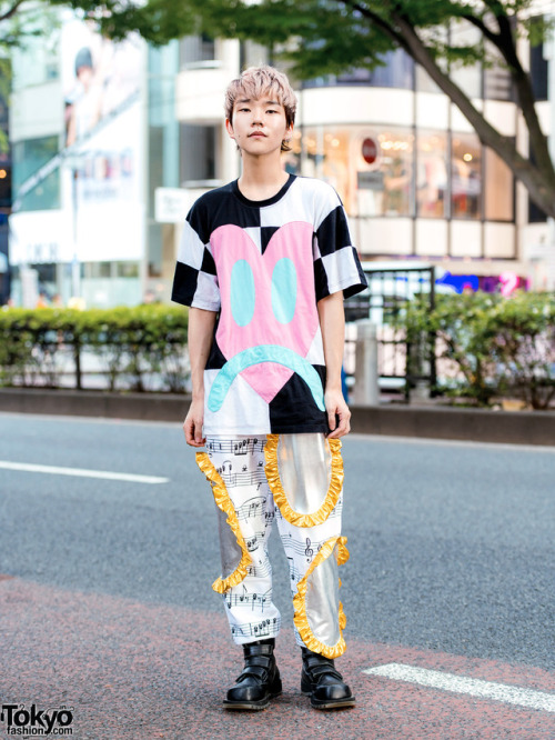 tokyo-fashion:  18-year-old Japanese student Nobuhiro on the street in Harajuku. He’s wearing a heart print top and sheet music print pants, both by Daniel Palillo, with Koji Kuga boots. Full Look