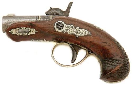 Percussion pocket pistol produced by Henry Deringer of Philadelphia, mid 19th century.from Amoskeag 