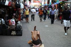 January 18, 2011 Petaling Street tourist spot in Kuala Lumpura beggar waiting for alms from visitors  http://www.mirror.co.uk/news/world-news/chinese-gang-mutilate-children-beggars-9111224