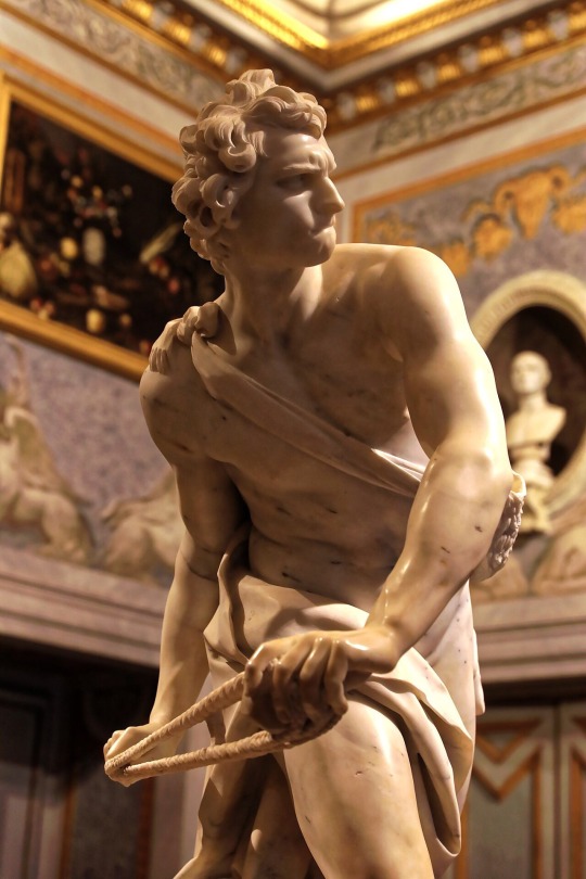 m1male2:David by Gian Lorenzo Bernini (1598-1680) one of the greatest baroque geniuses of his time.  Made in marble, the sculpture dates from 1623-24.  The work was commissioned by Cardinal Scipione Borghese, one of the sculptor’s patron and is