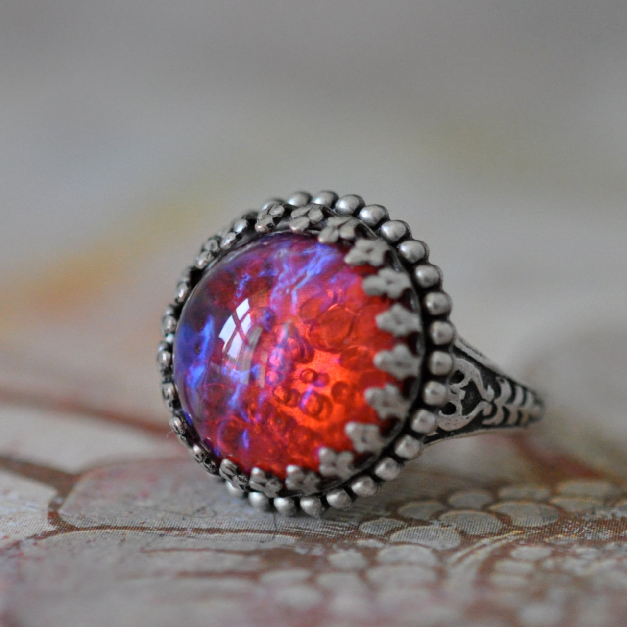 wickedclothes:  Dragons Breath Ring Dragon’s breath is a manmade gem, reddish pink