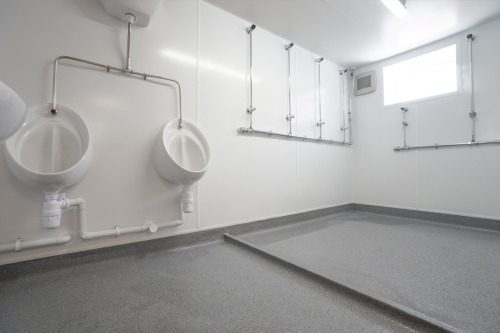 Football players shower room and urinals for Bradford City Football Club, at the Northern Commercial