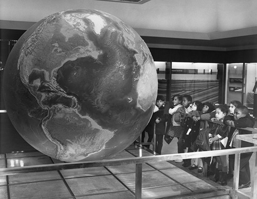 amnhnyc:  Happy Earth Day! From the archives: Children viewing Globe of the World