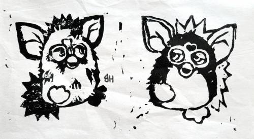 A stamp result in black ink, of two 1998 Furbies hopping together.