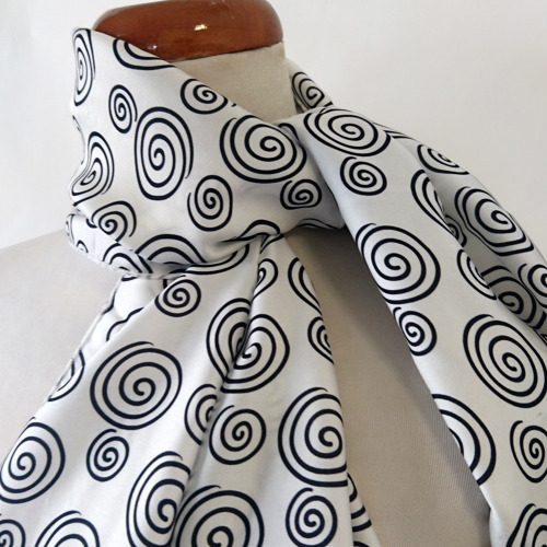 Black spiral pattern indelibly printed at white background, bold and clear, in high contrast design.