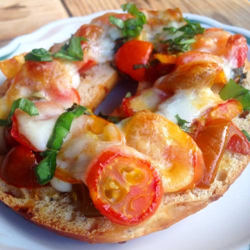 Tomato bread bagels for breakfast featuring 3 kinds of cherry tomatoes and basil from our garden, yu